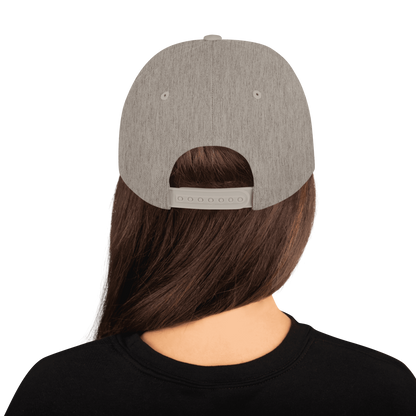 Scrambler Snapback Hat back view, natural heather cap with black underside brim and snapback strap