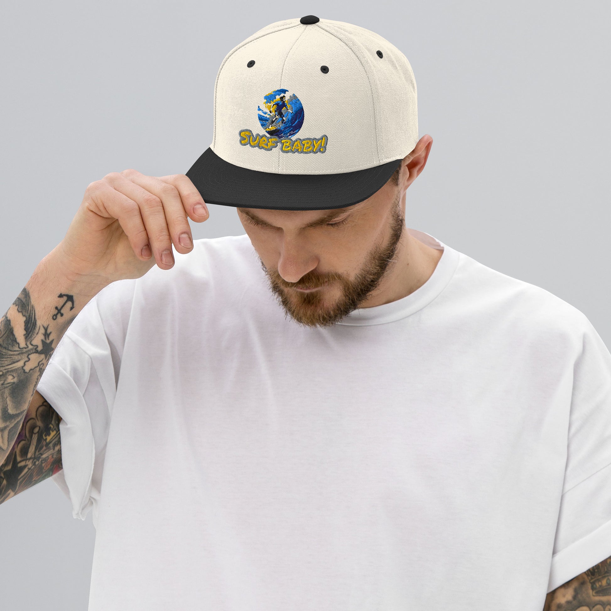 Snapback hat “Surf Baby” in natural/black, front graphic and black brim